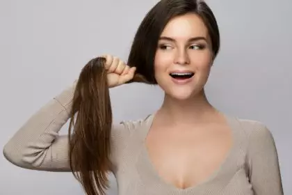 Woman is happy with her beautiful and healthy hair